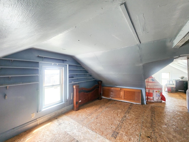 additional living space with lofted ceiling and plenty of natural light