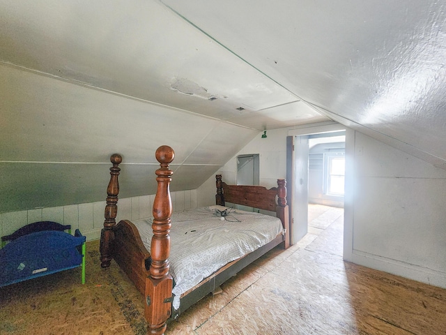 bedroom with lofted ceiling