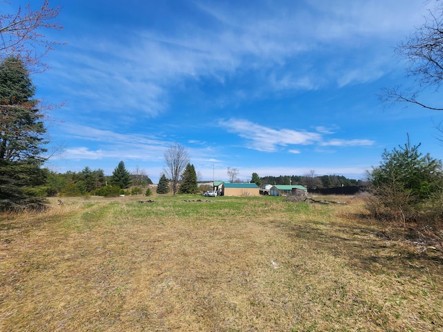 view of yard with a rural view