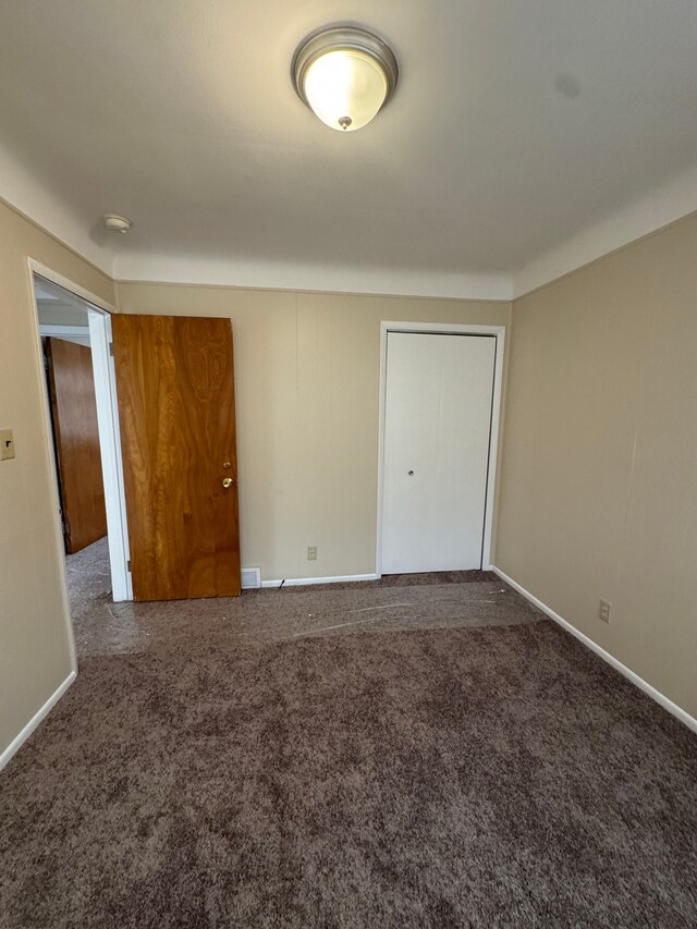 20950 Norwood Dr, Harper Woods, MI 48225 - unfurnished bedroom with baseboards, carpet flooring, and a closet