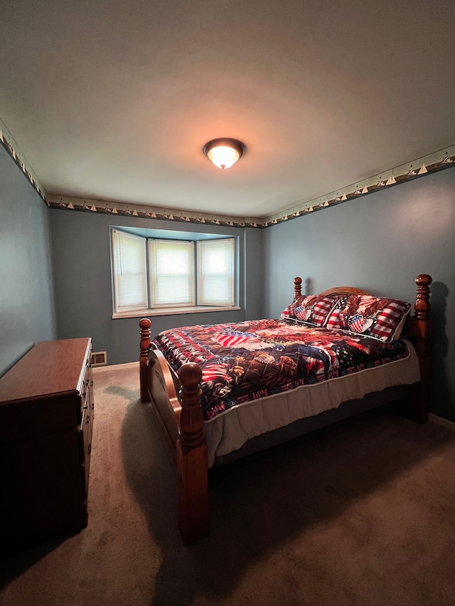 bedroom featuring carpet flooring and visible vents