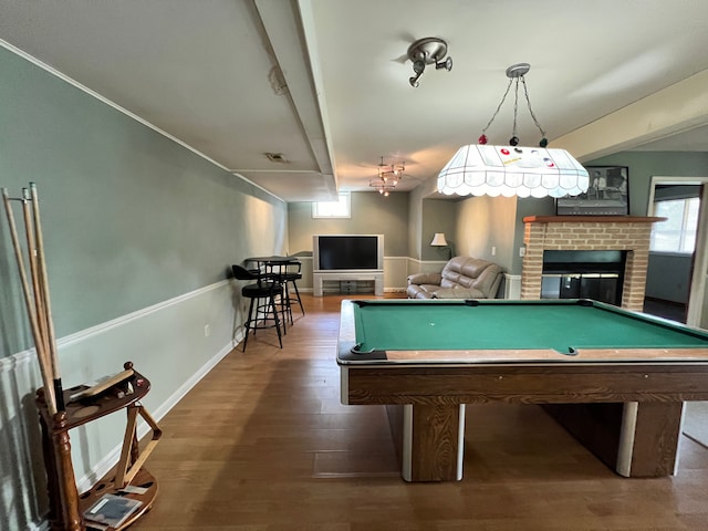 rec room featuring pool table, a fireplace, wood finished floors, and visible vents