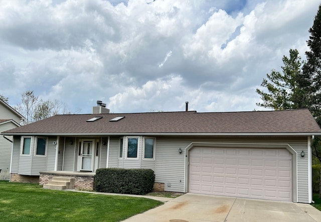 ranch-style home featuring a chimney, roof with shingles, a garage, a front lawn, and concrete driveway