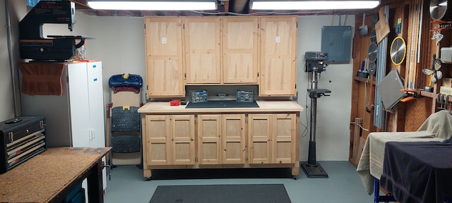 interior space with concrete flooring and electric panel