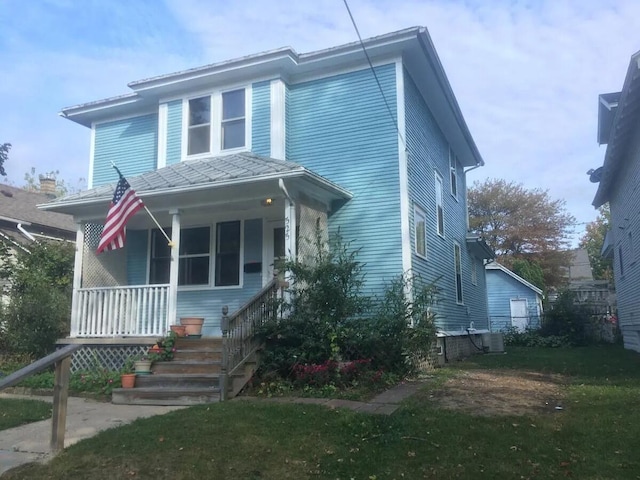 view of front facade featuring a porch and a front lawn