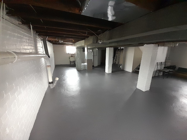 unfinished below grade area with a sink and stairs
