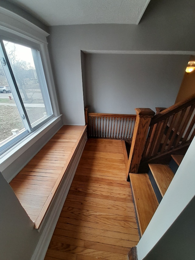 stairs with wood finished floors