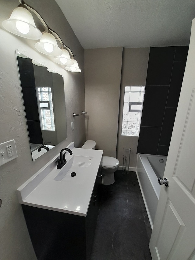 728 W Philadelphia St, Detroit, MI 48202 - full bath with toilet, vanity, a tub, and a textured ceiling