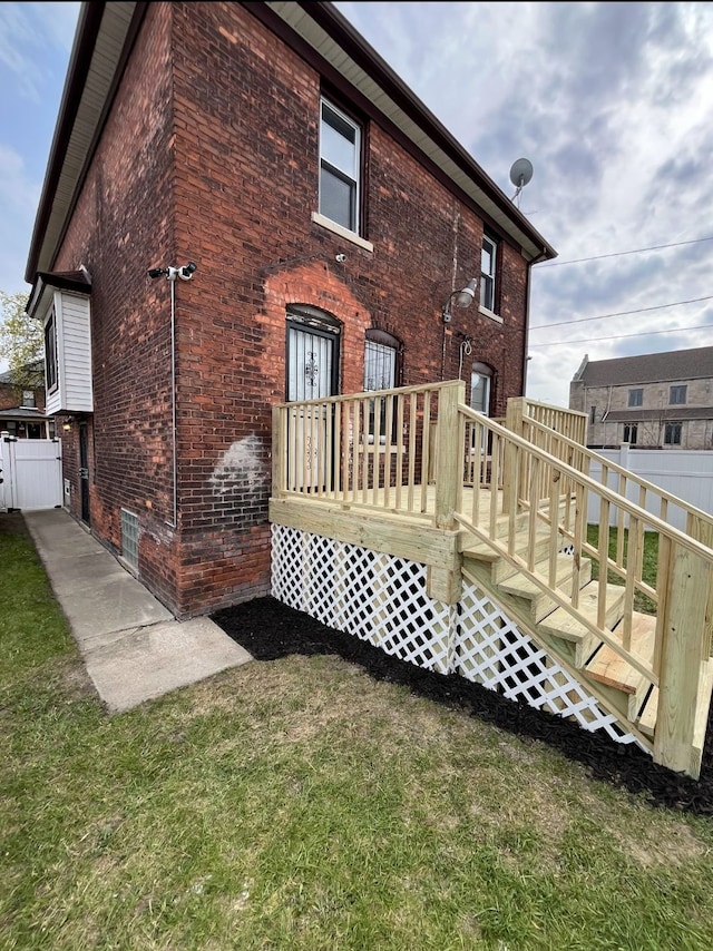 728 W Philadelphia St, Detroit, MI 48202 - back of house with brick siding and a wooden deck