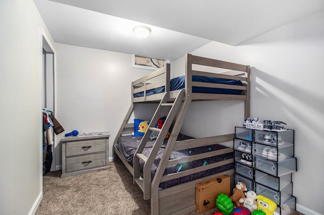 bedroom featuring carpet floors and baseboards