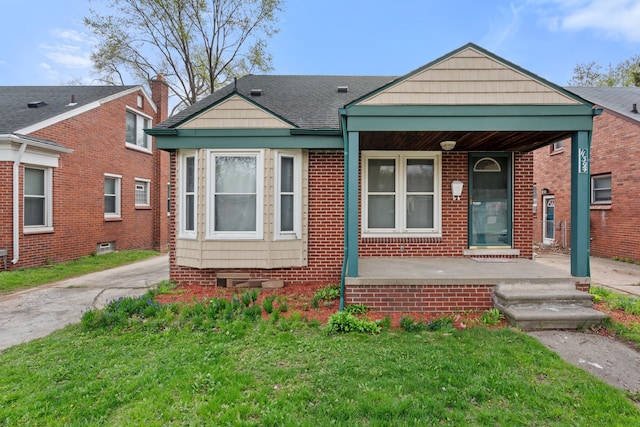 11394 Centralia, Redford, MI 48239 - view of front of property featuring brick siding, a front lawn, and covered porch