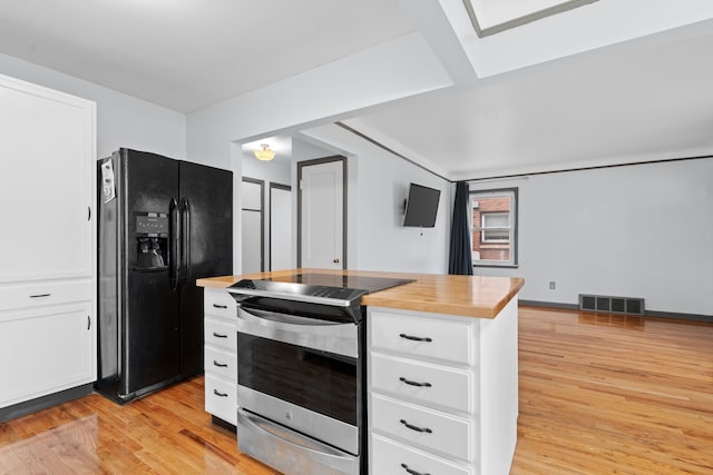 11394 Centralia, Redford, MI 48239 - kitchen featuring visible vents, light wood-type flooring, white cabinetry, black fridge, and stainless steel electric range oven