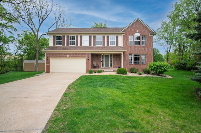 8313 Mill Pointe Ct, Goodrich, MI 48438 - traditional-style home with driveway, a garage, a front lawn, and brick siding