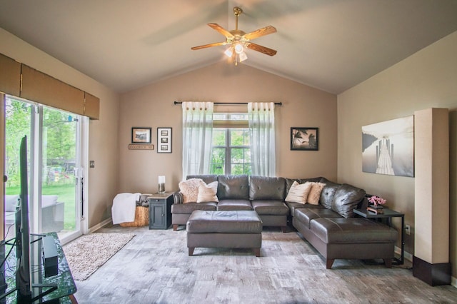 8313 Mill Pointe Ct, Goodrich, MI 48438 - living room with lofted ceiling, ceiling fan, wood finished floors, and baseboards