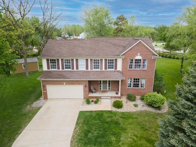 8313 Mill Pointe Ct, Goodrich, MI 48438 - view of front of property with driveway, a front lawn, an attached garage, and roof with shingles