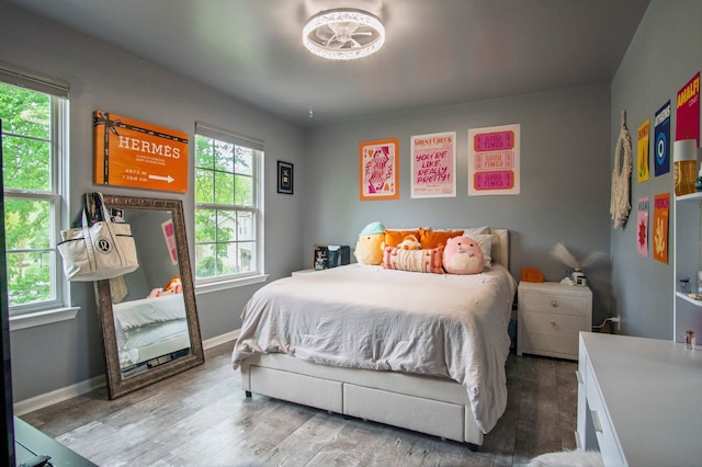 8313 Mill Pointe Ct, Goodrich, MI 48438 - bedroom with wood finished floors and baseboards