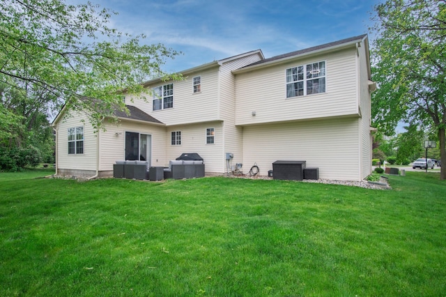 8313 Mill Pointe Ct, Goodrich, MI 48438 - back of house with a yard and an outdoor hangout area
