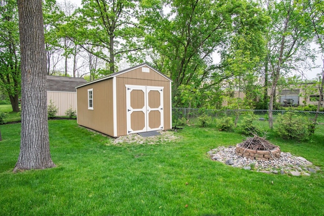 8313 Mill Pointe Ct, Goodrich, MI 48438 - view of shed featuring a fire pit