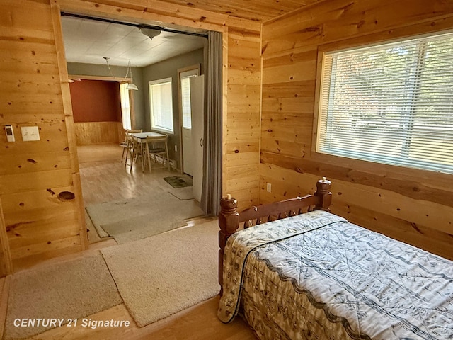 bedroom with wooden walls