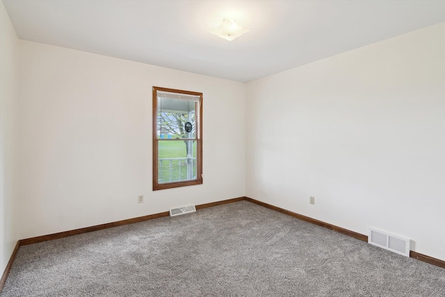 7996 Cain Rd, Jackson, MI 49201 - empty room featuring carpet flooring, visible vents, and baseboards