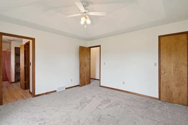 7996 Cain Rd, Jackson, MI 49201 - unfurnished bedroom featuring carpet, visible vents, ceiling fan, and baseboards