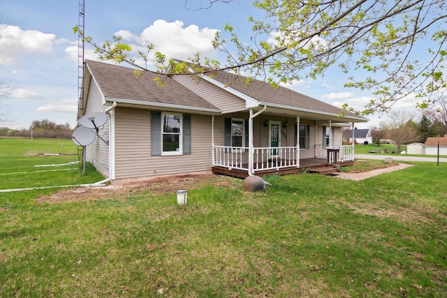 7996 Cain Rd, Jackson, MI 49201 - view of front of property featuring a front lawn, covered porch, and roof with shingles