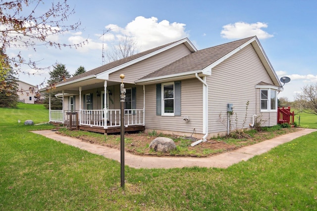 7996 Cain Rd, Jackson, MI 49201 - view of front facade featuring roof with shingles, covered porch, and a front yard