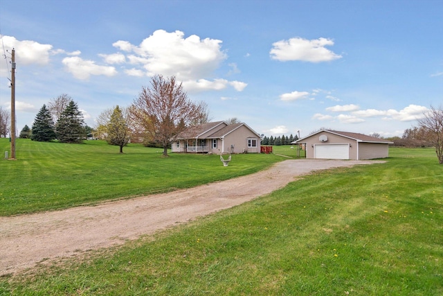 7996 Cain Rd, Jackson, MI 49201 - view of front of property featuring an outdoor structure, a front yard, dirt driveway, and a garage
