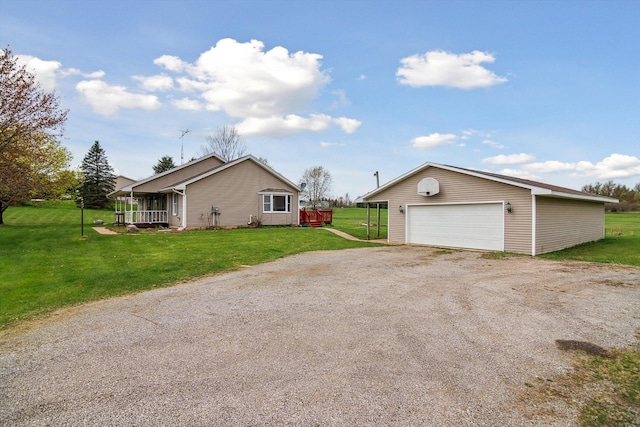 7996 Cain Rd, Jackson, MI 49201 - view of home's exterior featuring an outdoor structure, a lawn, and a garage