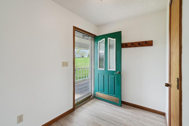 7996 Cain Rd, Jackson, MI 49201 - foyer entrance with light wood-type flooring and baseboards
