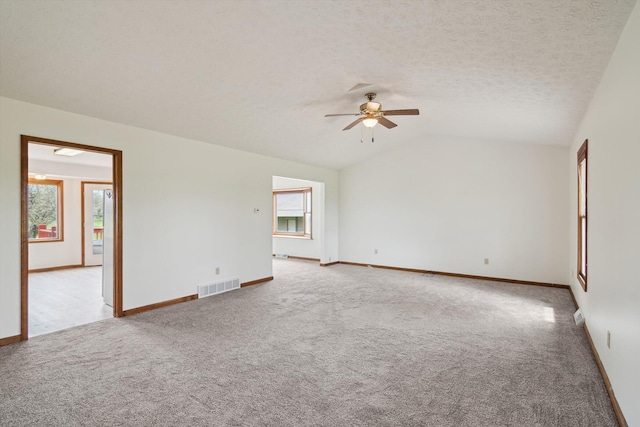 7996 Cain Rd, Jackson, MI 49201 - unfurnished room with a ceiling fan, visible vents, lofted ceiling, and carpet