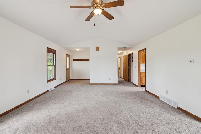 7996 Cain Rd, Jackson, MI 49201 - spare room with light colored carpet, visible vents, lofted ceiling, and baseboards