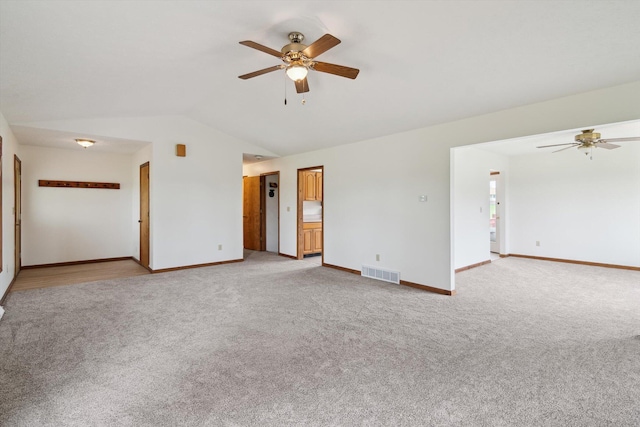 7996 Cain Rd, Jackson, MI 49201 - interior space with visible vents, light carpet, ceiling fan, and vaulted ceiling