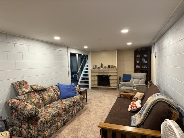 5346 E H Ave, Kalamazoo, MI 49048 - carpeted living room with recessed lighting, concrete block wall, and a fireplace with raised hearth