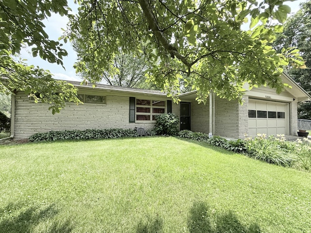 5346 E H Ave, Kalamazoo, MI 49048 - ranch-style home with a garage, brick siding, and a front lawn
