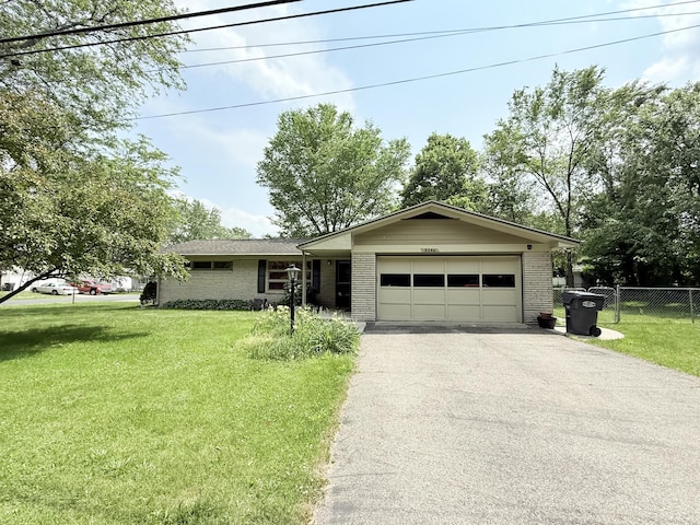 5346 E H Ave, Kalamazoo, MI 49048 - ranch-style house with driveway, an attached garage, and brick siding