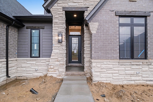 view of exterior entry with stone siding