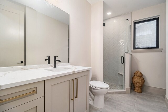 bathroom featuring tile patterned flooring, a shower stall, vanity, toilet, and recessed lighting