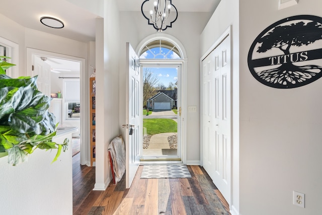 12031 E Schonborn Pl N Unit 3, Clio, MI 48420 - entrance foyer with baseboards, dark wood finished floors, and a chandelier
