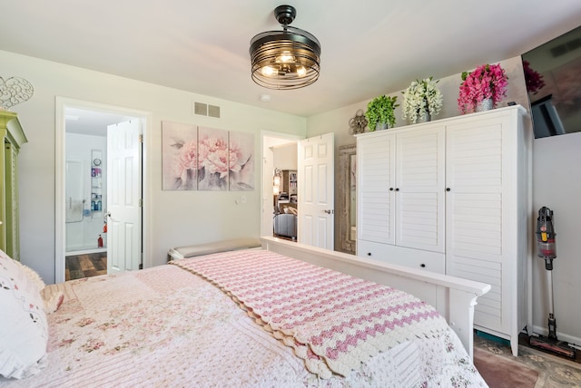 12031 E Schonborn Pl N Unit 3, Clio, MI 48420 - bedroom featuring visible vents and ensuite bath