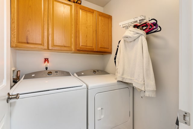12031 E Schonborn Pl N Unit 3, Clio, MI 48420 - clothes washing area featuring washing machine and clothes dryer and cabinet space