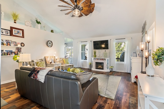 12031 E Schonborn Pl N Unit 3, Clio, MI 48420 - living room with a ceiling fan, high vaulted ceiling, dark wood finished floors, and a glass covered fireplace