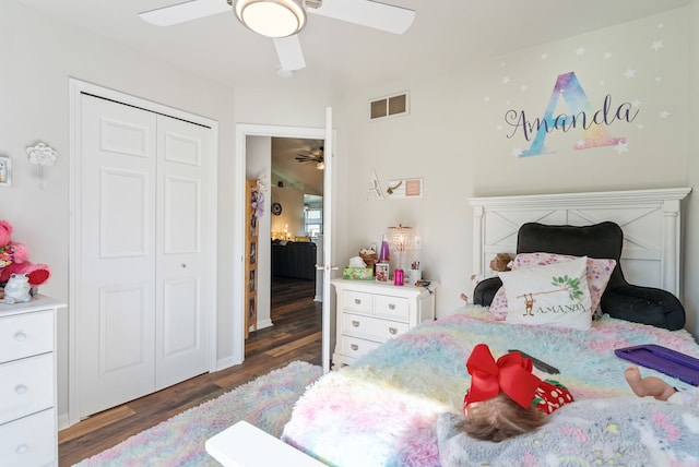 12031 E Schonborn Pl N Unit 3, Clio, MI 48420 - bedroom with a closet, ceiling fan, wood finished floors, and visible vents