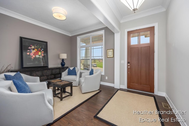 entrance foyer with dark wood-type flooring, a healthy amount of sunlight, and ornamental molding