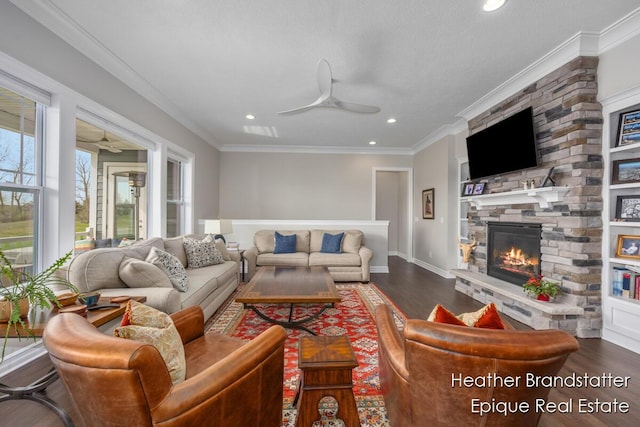 living area with dark wood-style floors, recessed lighting, a ceiling fan, and a fireplace