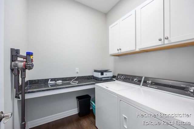 laundry room featuring washing machine and clothes dryer, cabinet space, dark wood finished floors, and baseboards