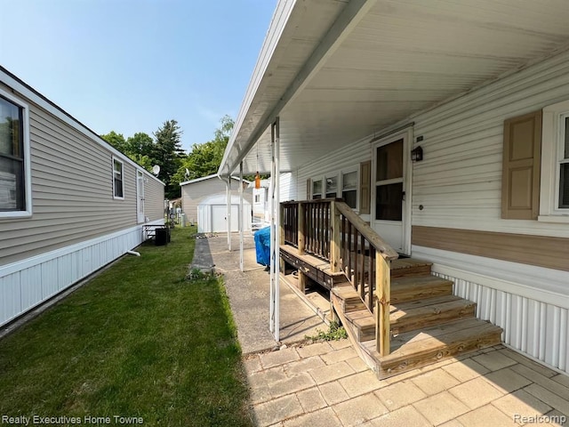 exterior space with a lawn, an outdoor structure, a storage unit, and central AC unit
