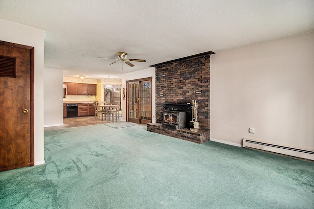 unfurnished living room featuring light colored carpet, a ceiling fan, a baseboard heating unit, and baseboards