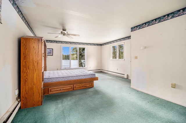 carpeted bedroom with ceiling fan, a baseboard heating unit, and baseboards