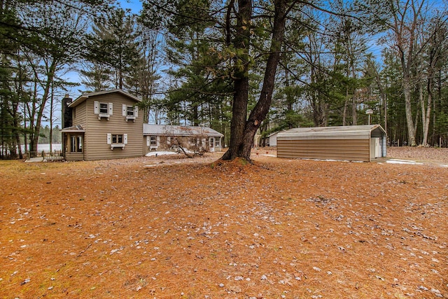 view of yard featuring an outbuilding and a storage shed